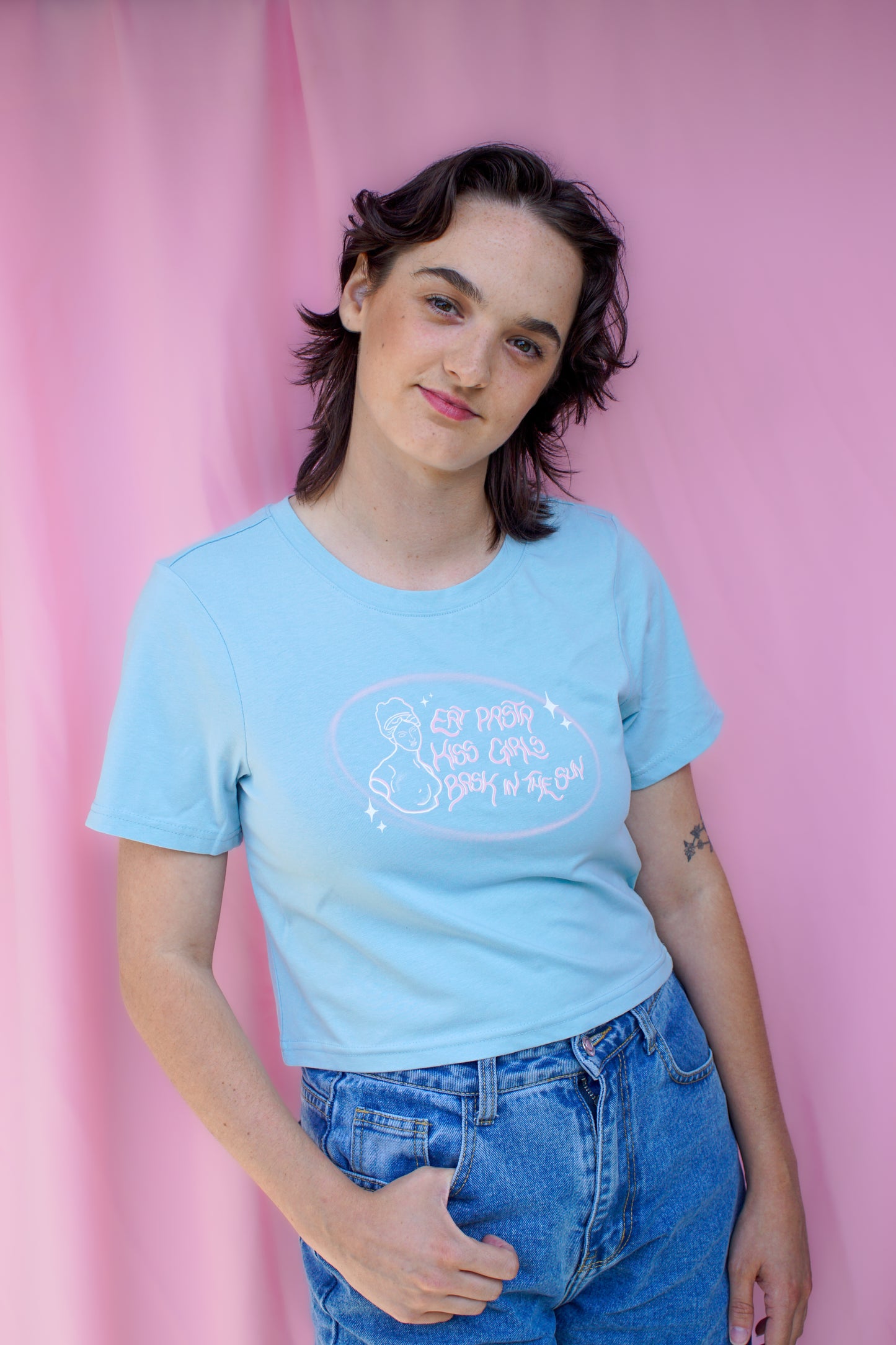 Eat pasta, kiss girls, bask in the sun baby tee.