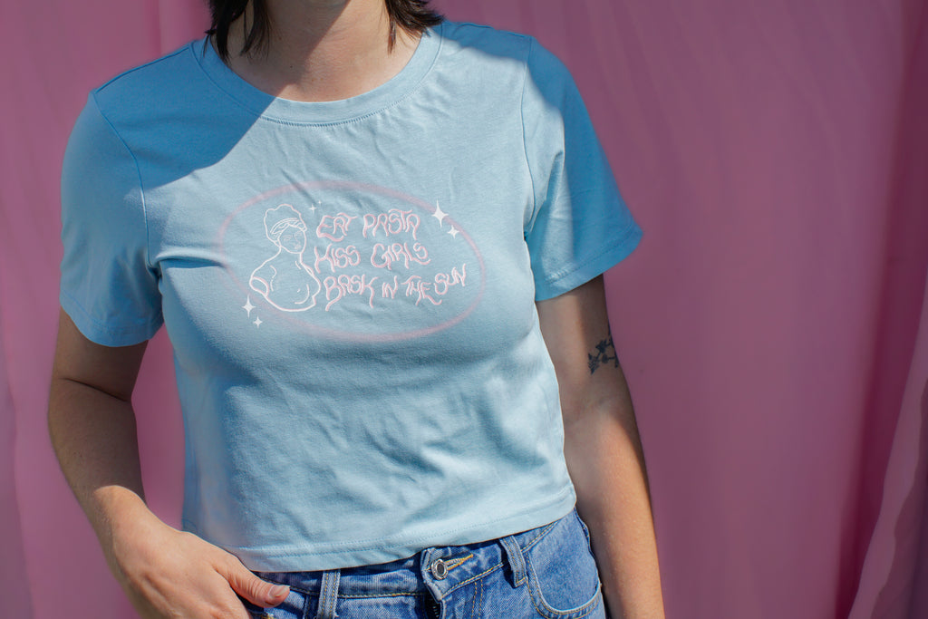Eat pasta, kiss girls, bask in the sun baby tee.