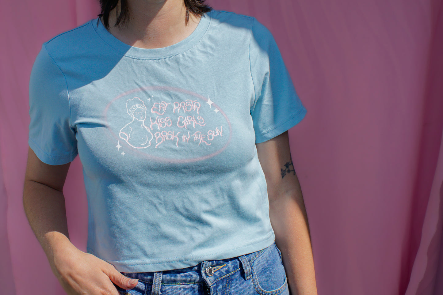Eat pasta, kiss girls, bask in the sun baby tee.